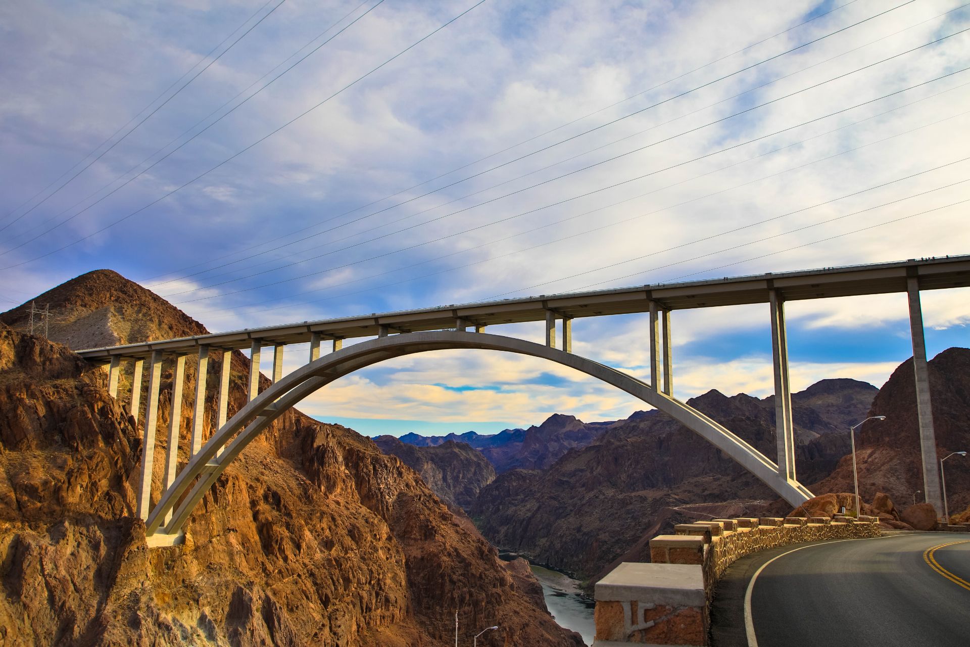Arched bridge spanning a rocky canyon