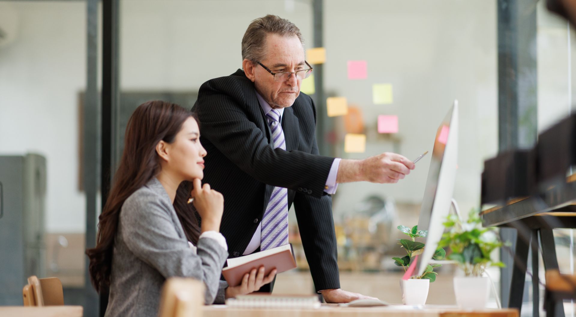 Executive coaching a colleague in a modern office
