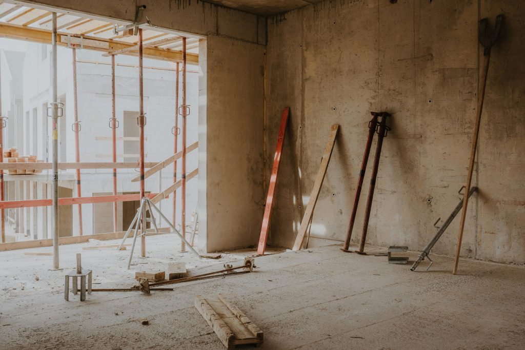 Unfinished building interior with exposed walls and construction materials